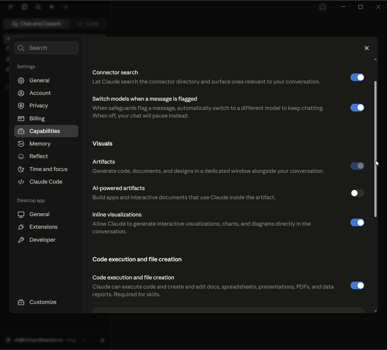 The Capabilities page in Settings on the fresh account: Connector search on, Artifacts and Inline visualizations on, AI-powered artifacts off, and Code execution and file creation on.