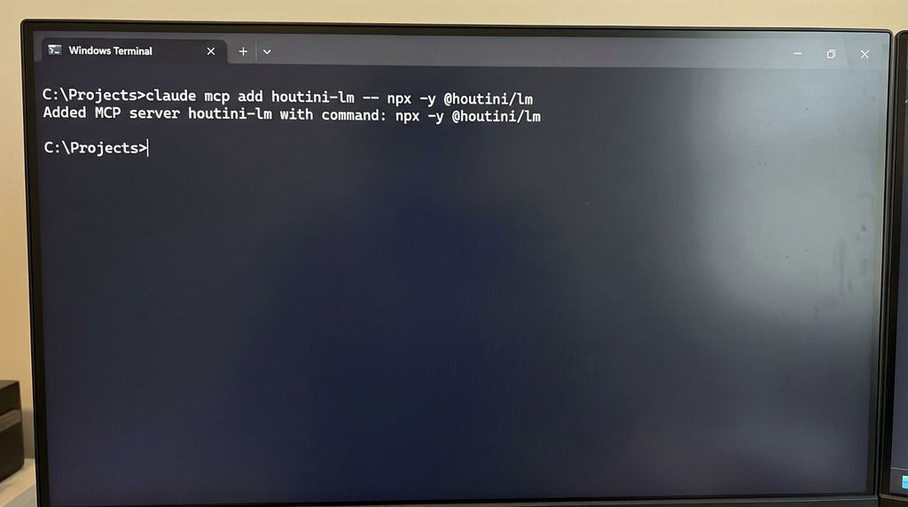 Windows Terminal showing the one-line houtini-lm install command: claude mcp add houtini-lm -- npx -y @houtini/lm